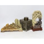 Two Chinese soapstone carvings and a pewter tea canister decorated with birds, largest 24cm high