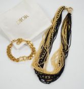 A Christian Dior Danseuse Etoile gilt bracelet, 18cm, with Dior box and pamphlet etc. together