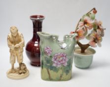 A Chinese flambé vase, famille rose jug, celadon plant pot and a Japanese porcelain figure,