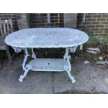 A Victorian style cast aluminium garden table, width 140cm, depth 94cm, height 72cm