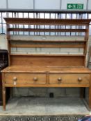 An early 19th century pine dresser with associated rack, width 184cm