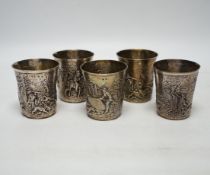 A set of five late 19th century German embossed 925 beakers, decorated with continuous hunting