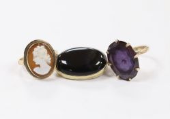 A 14k and oval cameo shell set ring, a 14k and synthetic colour change corundum set ring and a
