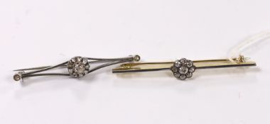 An early to mid 20th century, yellow metal and nine stone diamond cluster set flower head bar