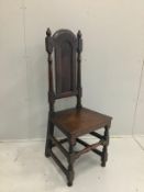 A late 17th century oak panel back chair