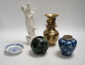 A Chinese blanc de chine model of Guanyin, a bronze vase, a hardstone concentric ball, a blue jar