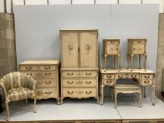 An 18th century style painted seven piece bedroom suite, comprising press cupboard, pair of