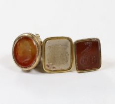 Three assorted 19th century carnelian set fob seals, including one gold plated and two yellow