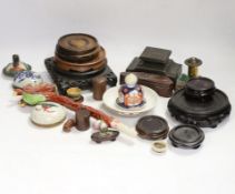 A collection of mixed Chinese wooden stands, a ceramic dragon head and miscellaneous ceramics