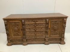 A late 19th century Flemish carved oak sideboard, width 181cm, depth 63cm, height 90cm