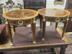 A pair of Empire style circular gilt metal mounted occasional tables, diameter 61cm, height 53cm