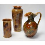 Two Doulton natural foliage ware vases and a jug, 25cm