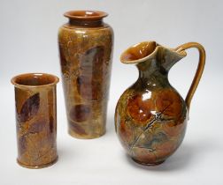 Two Doulton natural foliage ware vases and a jug, 25cm