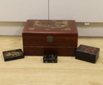 A Japanese lacquer writing box and three black lacquer or papier mache boxes
