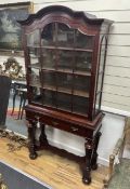An early 20th century Dutch mahogany display cabinet on stand, width 93cm, depth 35cm, height 187cm