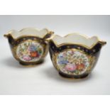 A pair of 19th century Paris porcelain cache pot hand painted with flowers and gilded decoration,