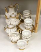 A Meissen gilt and white glazed porcelain tea service, mid 20th century, comprising a teapot, coffee