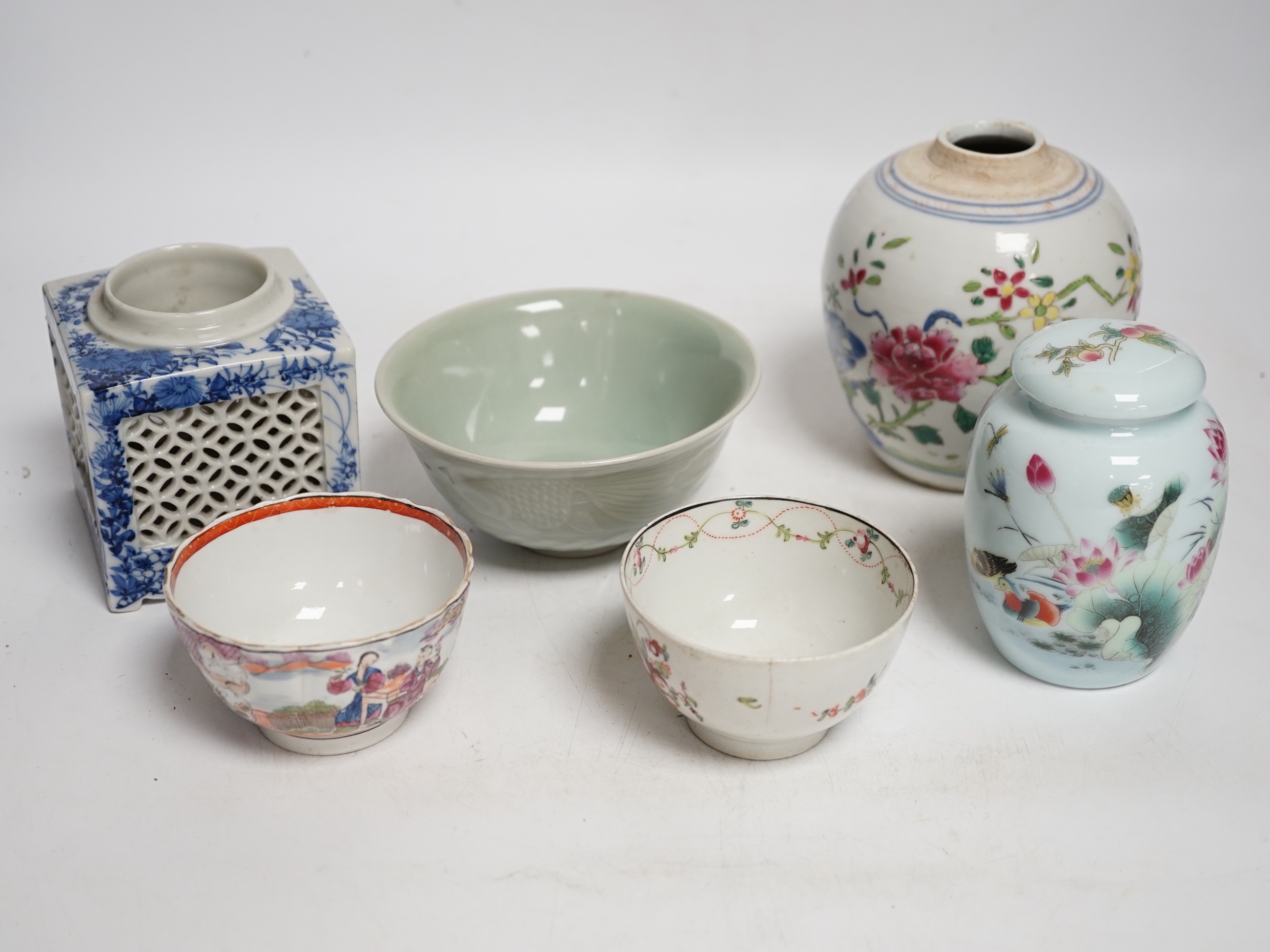 A collection of Chinese ceramics including celadon bowl decorated in low relief with fish, famille