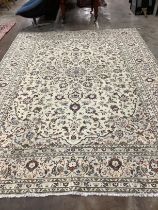 A Kashan ivory ground carpet, 345 x 245cm