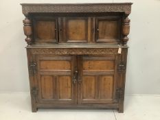A 17th century and later carved oak court cupboard, width 141cm, depth 51cm, height 157cm