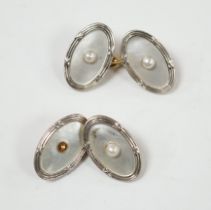 A pair of Edwardian 15ct, mother of pearl and seed pearl set oval cufflinks, 17mm, gross weight 7.