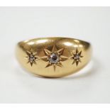 A George V 18ct gold and three stone gypsy set diamond chip set ring, size R, gross weight 3.3