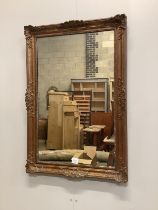 A Victorian style giltwood and composition rectangular wall mirror, width 64cm, height 95cm