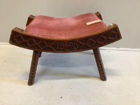 A Liberty chip carved stool, dated 1893, width 56cm, height 34cm