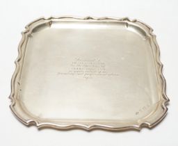 A George V silver shaped square presentation salver, with later engraved inscription, A.E.