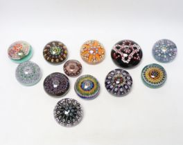 Twelve various mixed glass paperweights