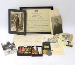 An archive of family collection of medals, photographs and documents including a WWI trio of War