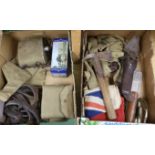 A collection of militaria including a union flag, gunners sight, camouflage webbing, a water bottle,