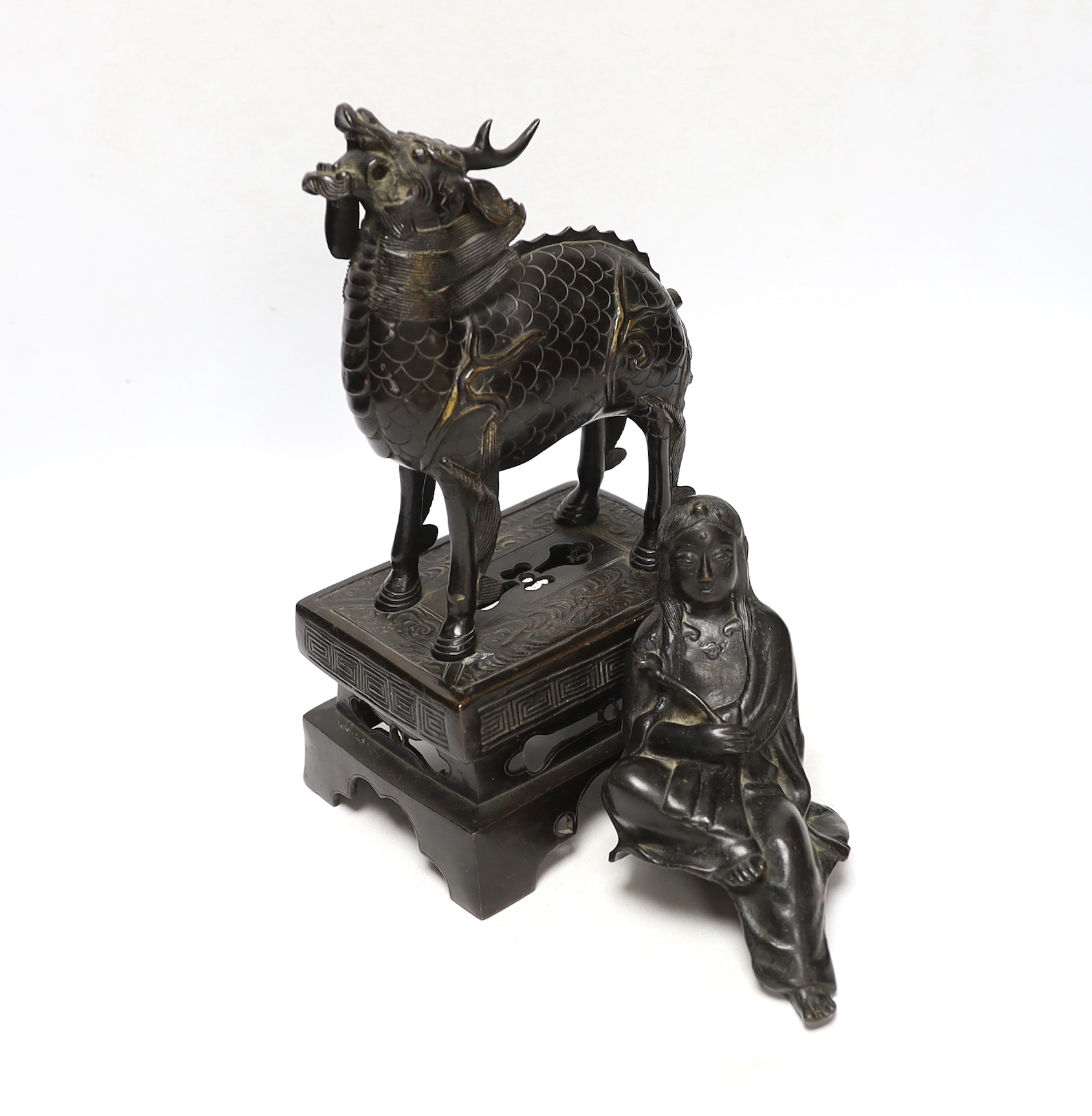 An 18th century Chinese bronze figure of a qilin together with a Japanese figural bronze mount,