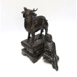 An 18th century Chinese bronze figure of a qilin together with a Japanese figural bronze mount,