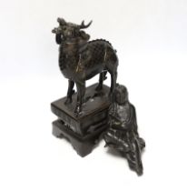An 18th century Chinese bronze figure of a qilin together with a Japanese figural bronze mount,