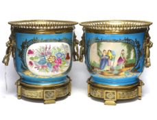 A pair of brass mounted Kusnetzoff style jardinières hand painted with figures, 28cm high