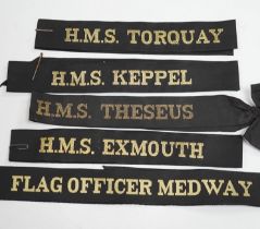 A collection of Royal Navy cap ribbons (tallies), including HMS Torquay, HMS Keppel, Commander Far
