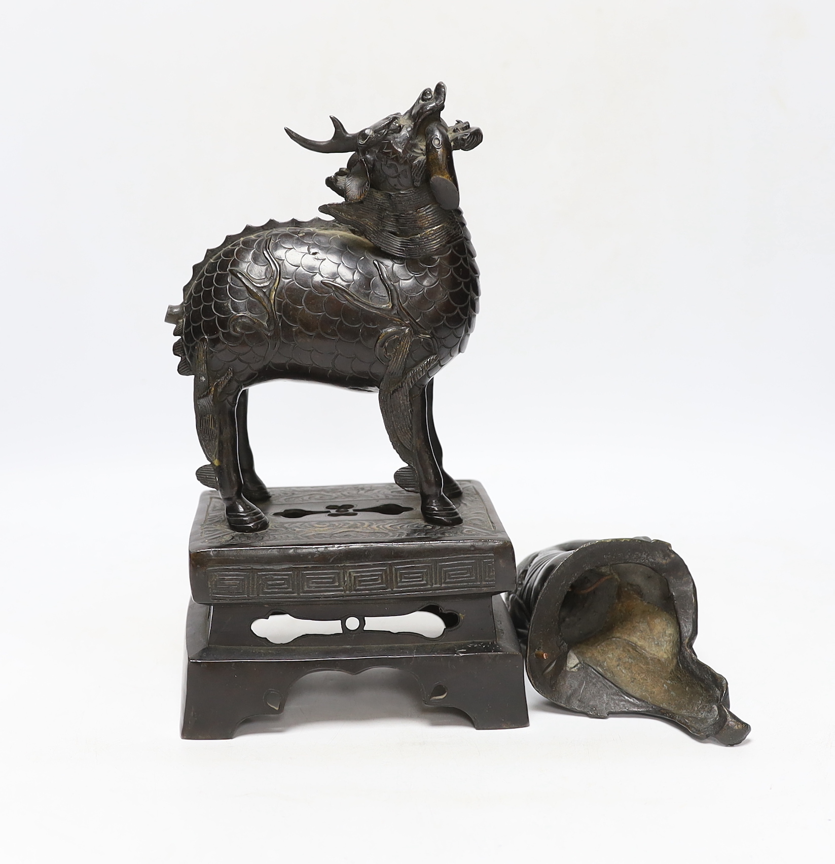 An 18th century Chinese bronze figure of a qilin together with a Japanese figural bronze mount, - Image 4 of 4