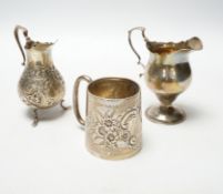 A Victorian silver inverted pyriform cream jug, London, 1886, 10.4cm, another, embossed, Chester,