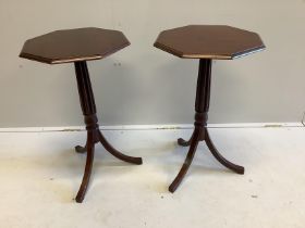 A pair of Regency style octagonal mahogany tripod wine tables, width 43cm, height 73cm