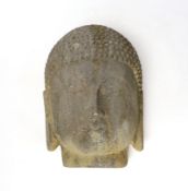 A reconstituted stone model of Buddha’s head, 25cm