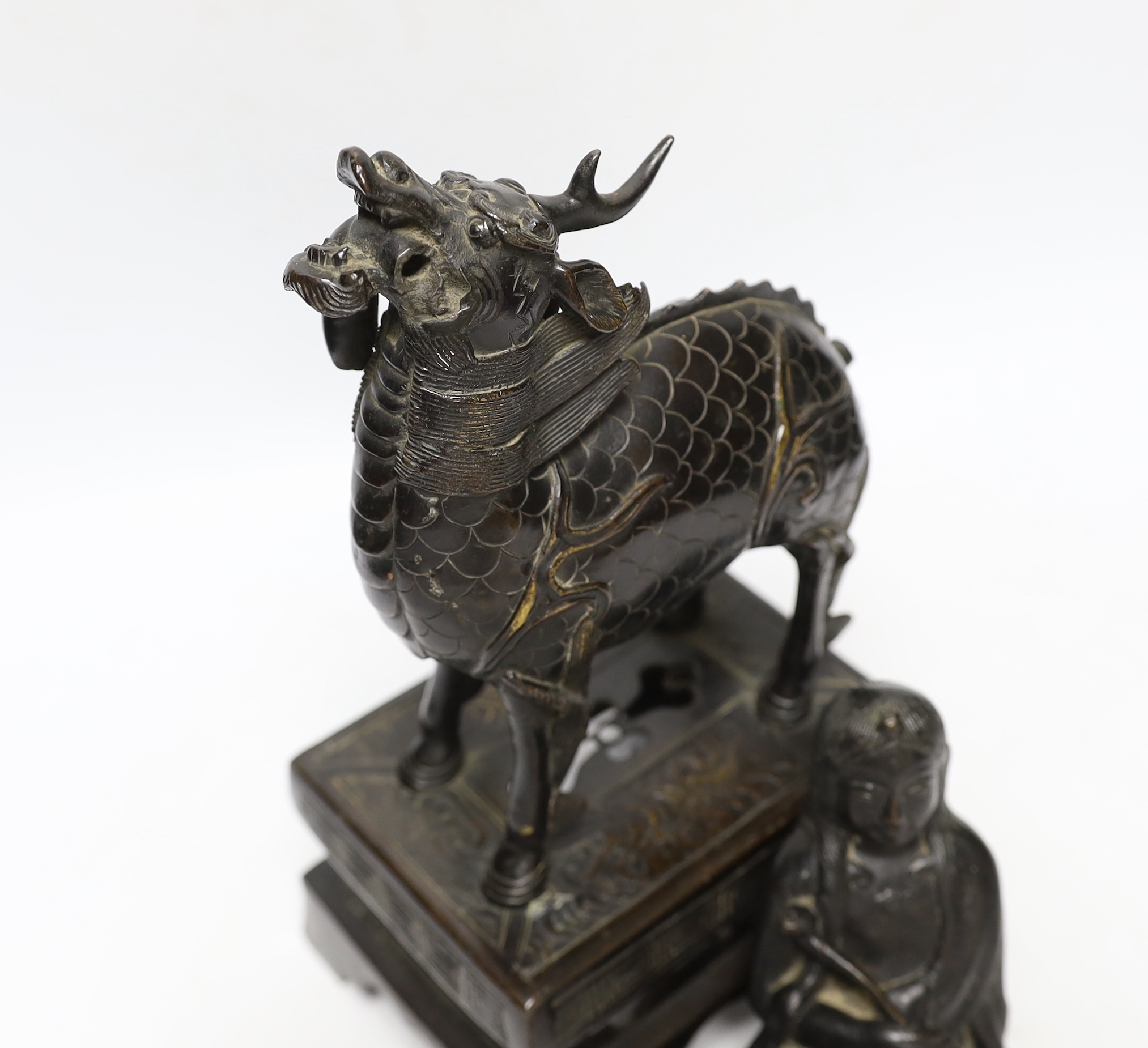 An 18th century Chinese bronze figure of a qilin together with a Japanese figural bronze mount, - Image 3 of 4