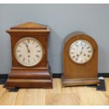 Two early 20th century mantel clocks; a mahogany timepiece and an inlaid Edwardian clock with engine
