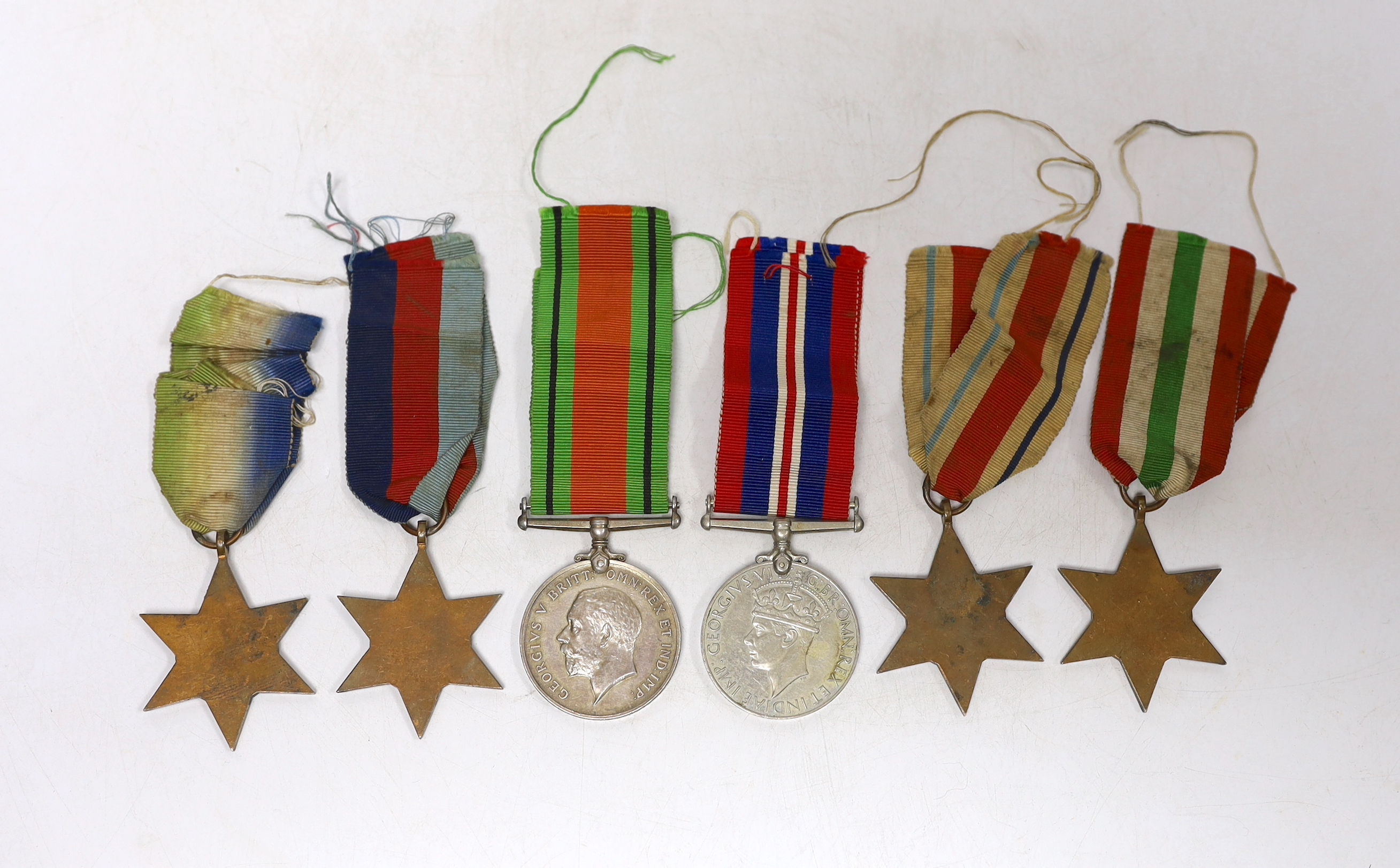 Six WWII medals. The Atlantic Star, The Italy Star, The Africa Star, The 1939-45 Star, The Defence - Image 2 of 2