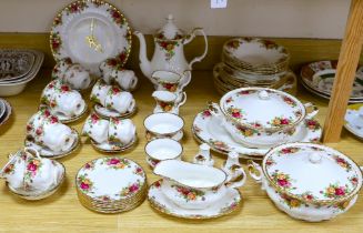 A Royal Albert Old Country Rose dinner service and tea service including trios, tureens and oval