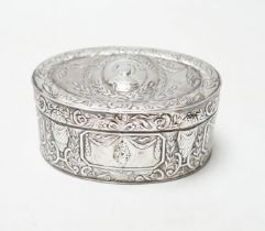 An Edwardian Hanau silver oval box, with hinged cover and foliate and swag decoration, import