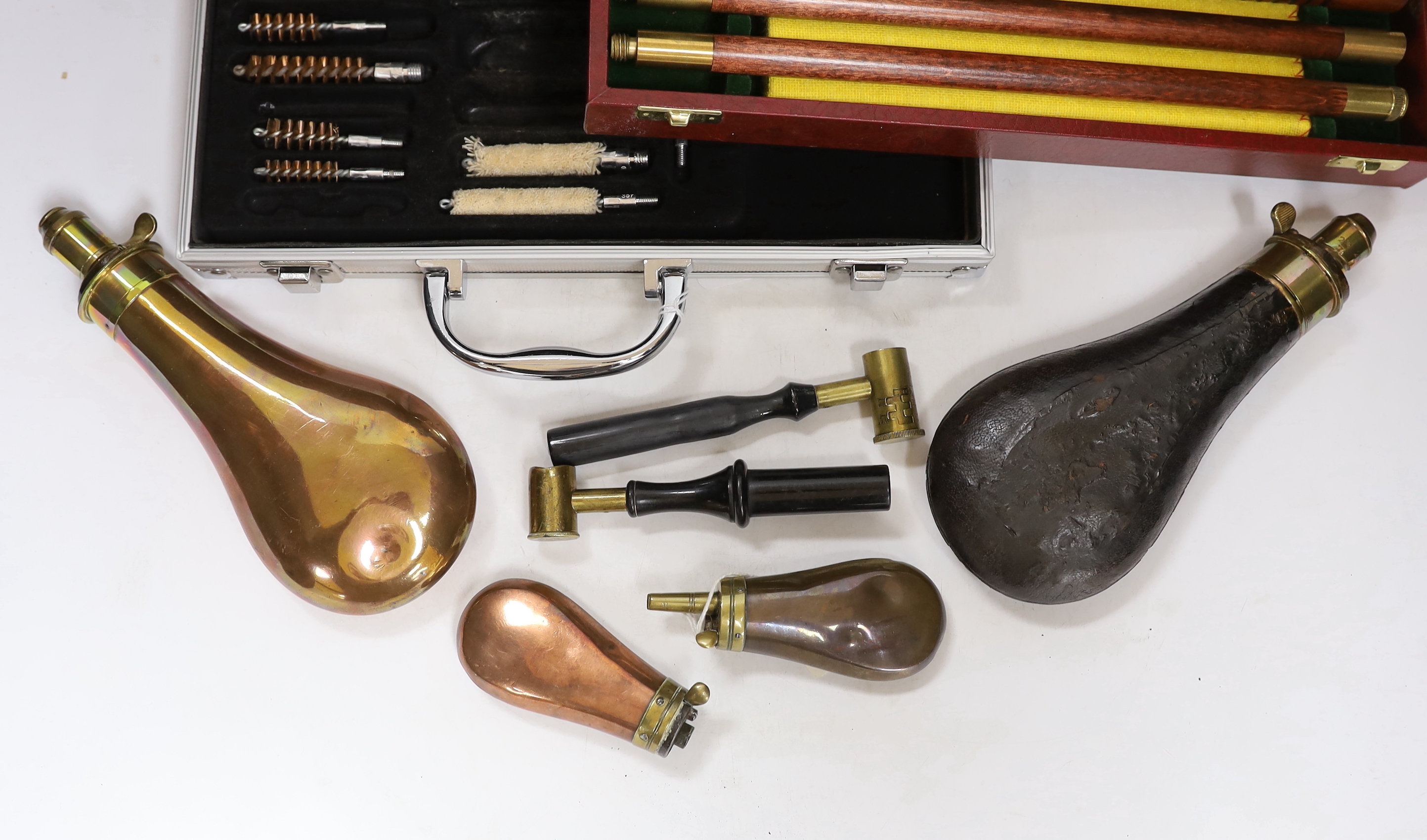 Three copper powder flasks, a leather powder flask, two powder measures and two cases of cleaning - Image 2 of 4