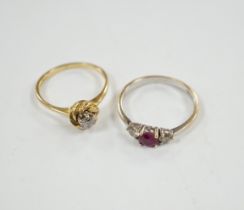 A modern 18ct white gold, ruby and diamond set three stone ring, size N/O and a 1970's 18ct gold and