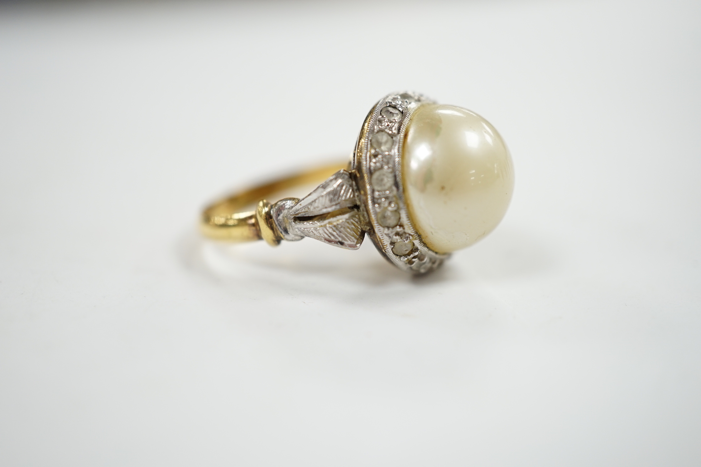 A yellow metal, simulated mabe pearl and paste set cluster ring, size O, gross weight 4.6 grams. - Image 3 of 4