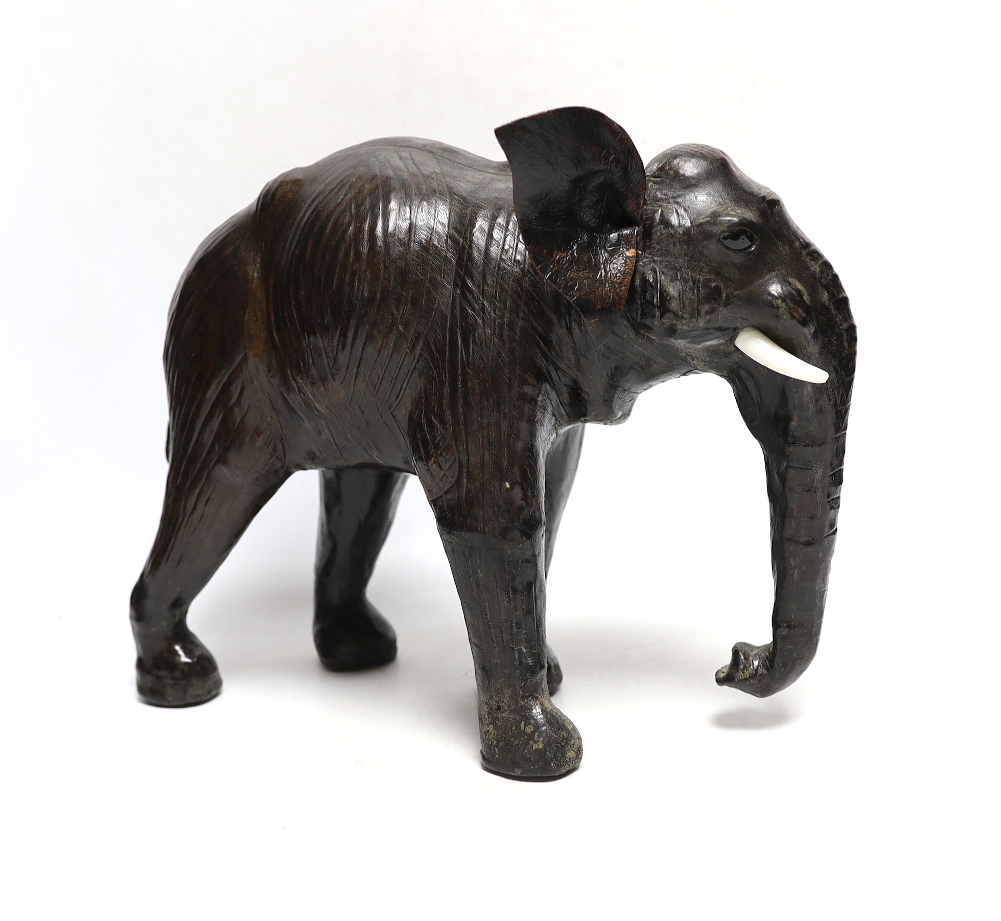 A leather elephant, stamped Liberty to the underside, 30cm wide - Image 2 of 4